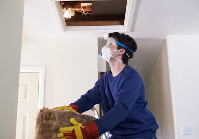 Man,Climbing,Into,Loft,To,Insulate,House,Roof